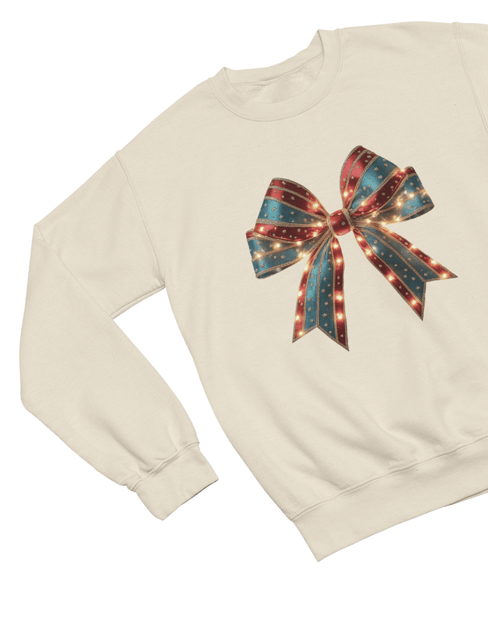 beige sweatshirt with glittery coquette christmas bow print