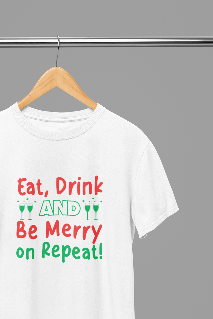 white t-shirt with eat drink be merry repeat christmas slogan design