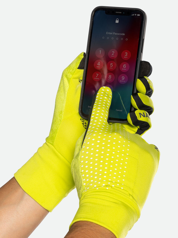 color:Hi Vis Yellow/Geo Print||seo:Nathan HyperNight Reflective Gloves - Hi Vis Yellow - Model Using Unlocking Cell Phone with Gloves On