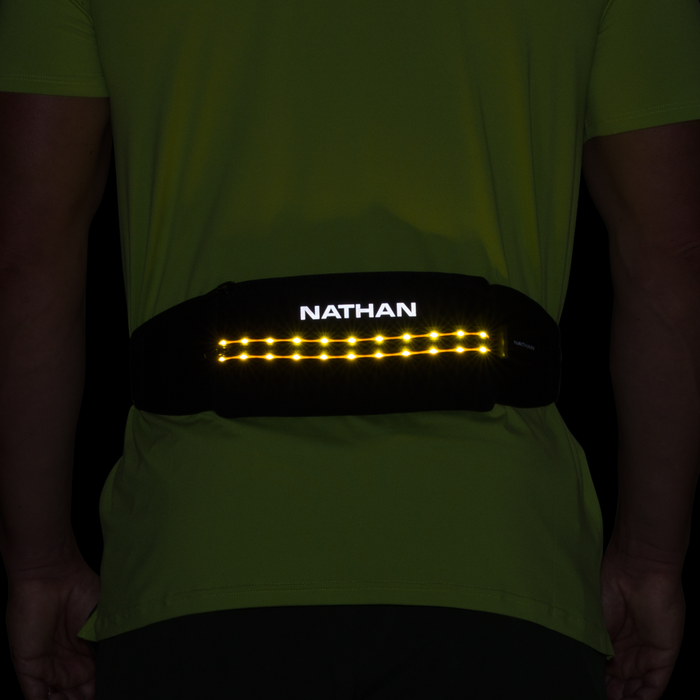 color:Black/High Vis Yellow||view:SKU Image Back||seo:Nathan Laser Light 5K Belt RX - Black/High Vis Yellow - On Model - Lighting On i in the Dark with Reflective Highlights
