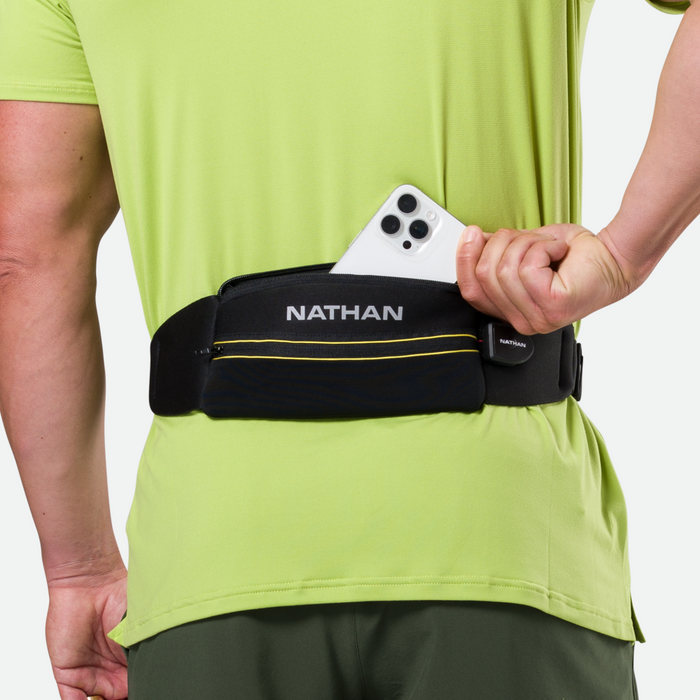 color:Black/High Vis Yellow||seo:Nathan Laser Light 5K Belt RX - Black/High Vis Yellow - Model Pulling Out iPhone From Storage Pocket
