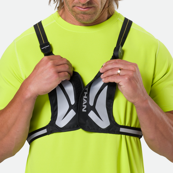 color:Black/High Vis Yellow||seo:Nathan Laser Light Web Vest RX Vest - Black/High Vis Yellow - On Model - Model Removing Vest