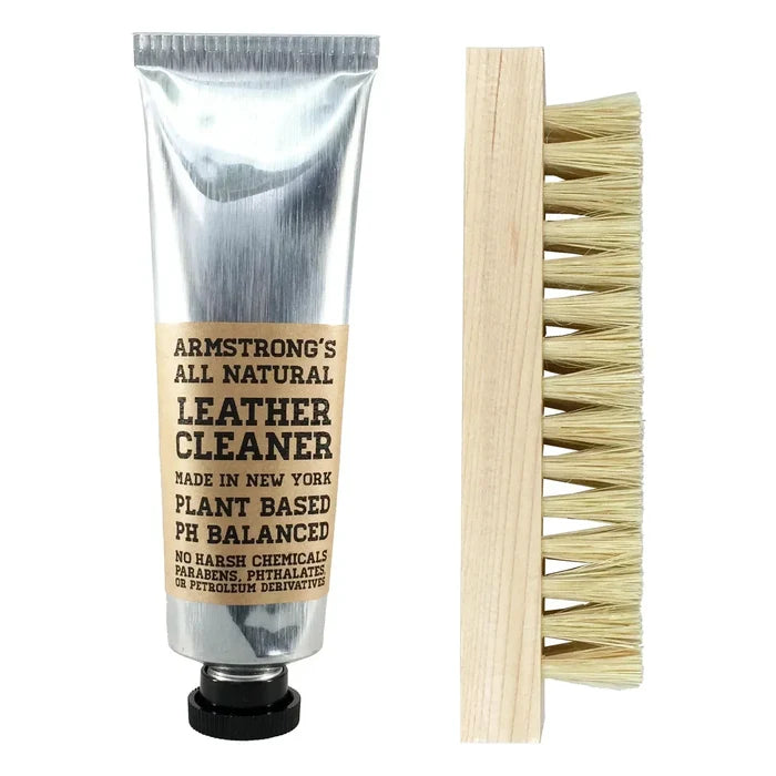 Armstrong's all natural leather cleaner with a brush on a white background