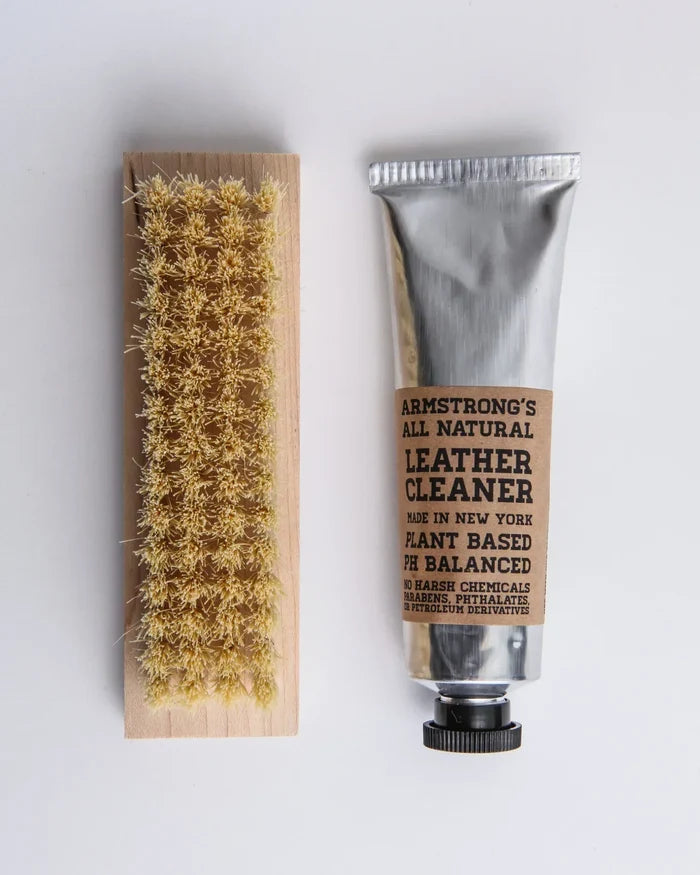 Leather cleaner with brush and Armstrong's All Natural Leather Cleaner tube on a white background