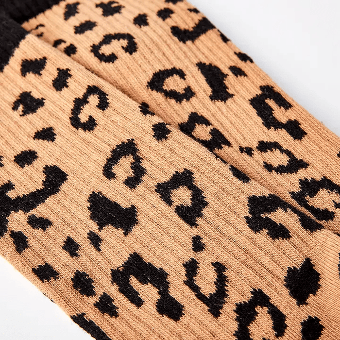 cream socks with bold leopard print design for unisex gift giving