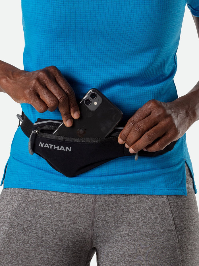 color:Black/Reflective Silver||seo:Nathan Mirage Pak Plus Adjustable Belt - Black - Runner Pulling Cell Phone/Smartphone from Storage Pocket
