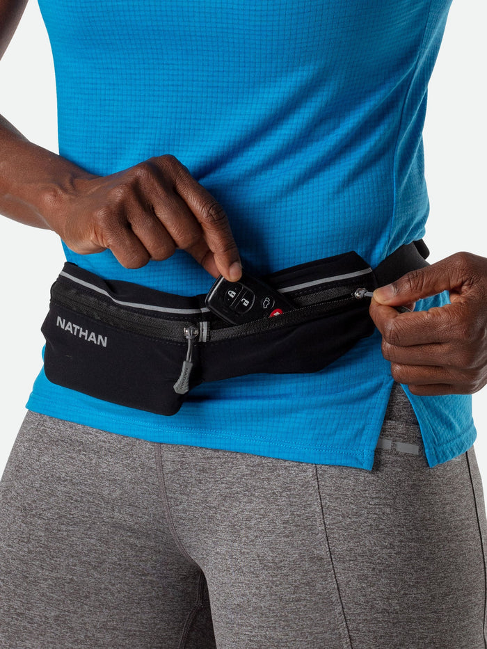 color:Black/Reflective Silver||seo:Nathan Mirage Pak Plus Adjustable Belt - Black - Runner Pulling Key Fob from Storage Pocket
