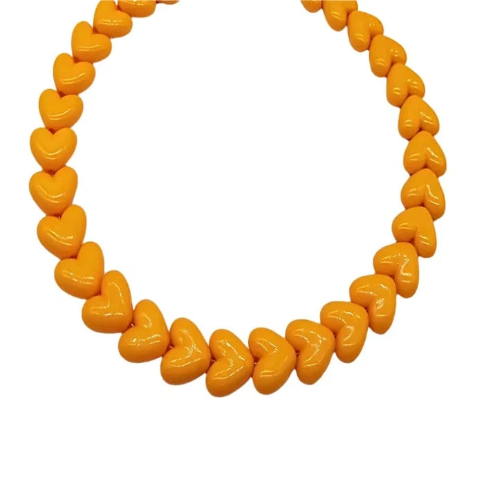 orange resin heart necklace with chunky hearts on collarbone chain