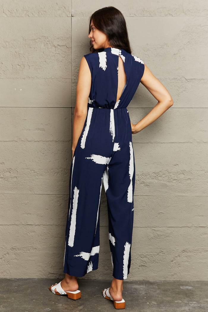 Perfee Printed Round Neck Cutout Pocketed Jumpsuit