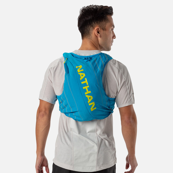 color:Blue Me Away/Finish Lime||seo:Nathan Pinnacle 12 Liter Unisex Hydration Race Vest - Blue Me Away/Finish Lime Green - Male Runner Back View