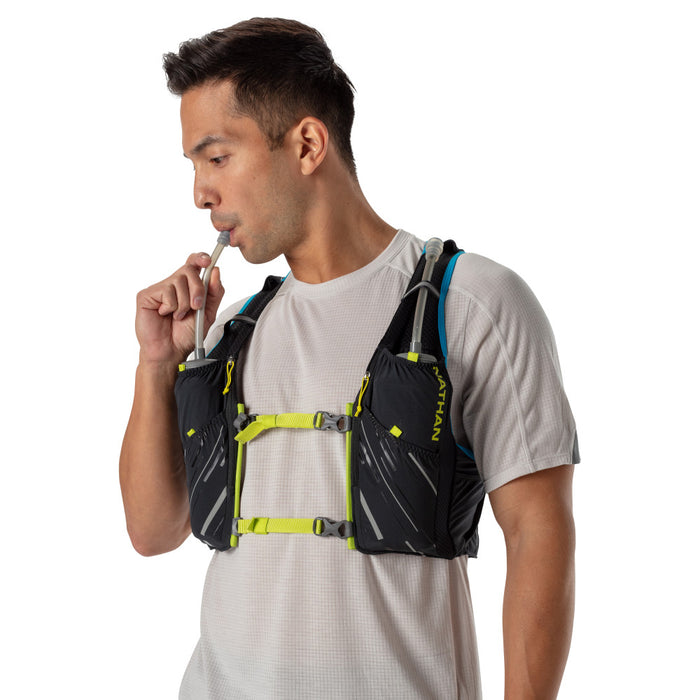 color:Black/Finish Lime||seo:Nathan Pinnacle 4 Liter Men's Hydration Race Vest - Black/Finish Lime Green - Male Runner Taking Sip of Water From Front Flask Bottle