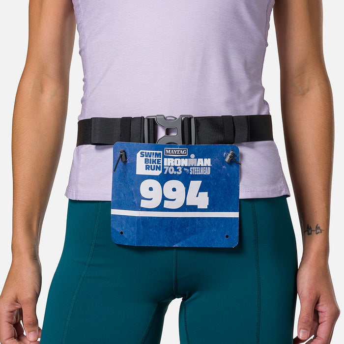 color:Black/Reflective Silver||seo:Nathan Pinnacle FeatherLite Unisex Hydration Waist Belt - Black/Reflective Silver - Model Wearing Clip On Race Belt For Surf City Half Marathon