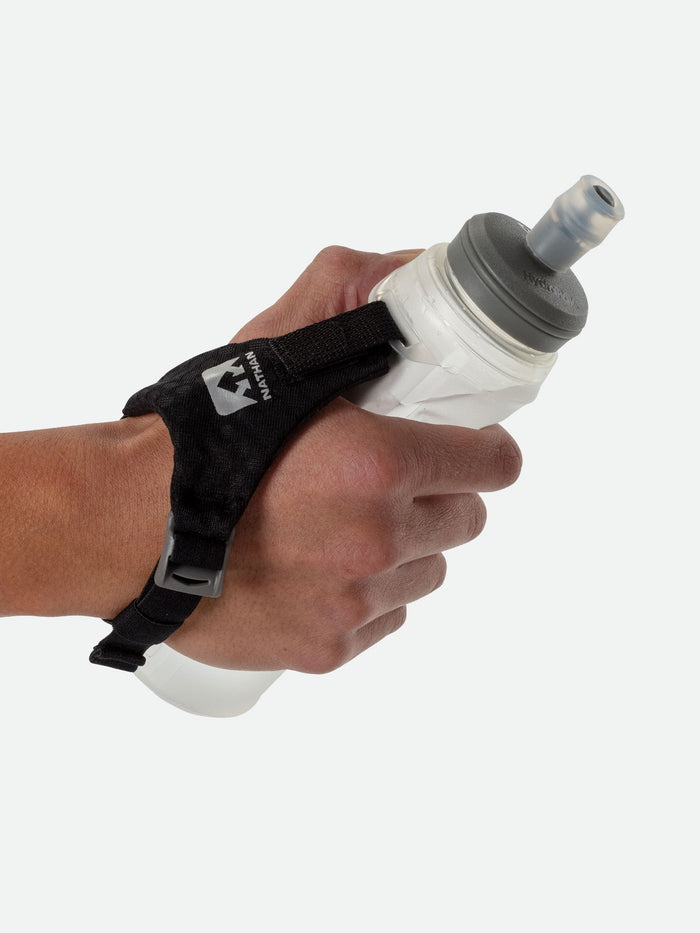 color:Clear||seo:Nathan Pinnacle Lite Handheld 14oz - Clear - Runner Gripping Handheld Through Strap
