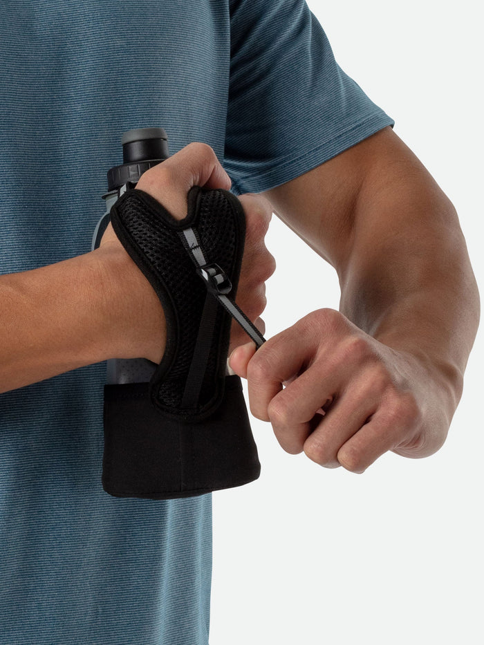 color:Black/Marine Blue||seo:NATHAN QuickSqueeze Lite 12oz Insulated Handheld - Black/Marine Blue - Runner Pulling Strap to Tighten Handheld Around the Palm