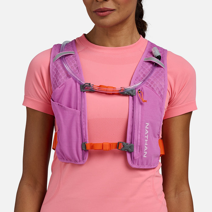color:Fuchsia/Orange Blaze||seo:Nathan QuickStart 3.0 4 Liter Hydration Pack - Fuchsia/Orange Blaze - On Model - Front View