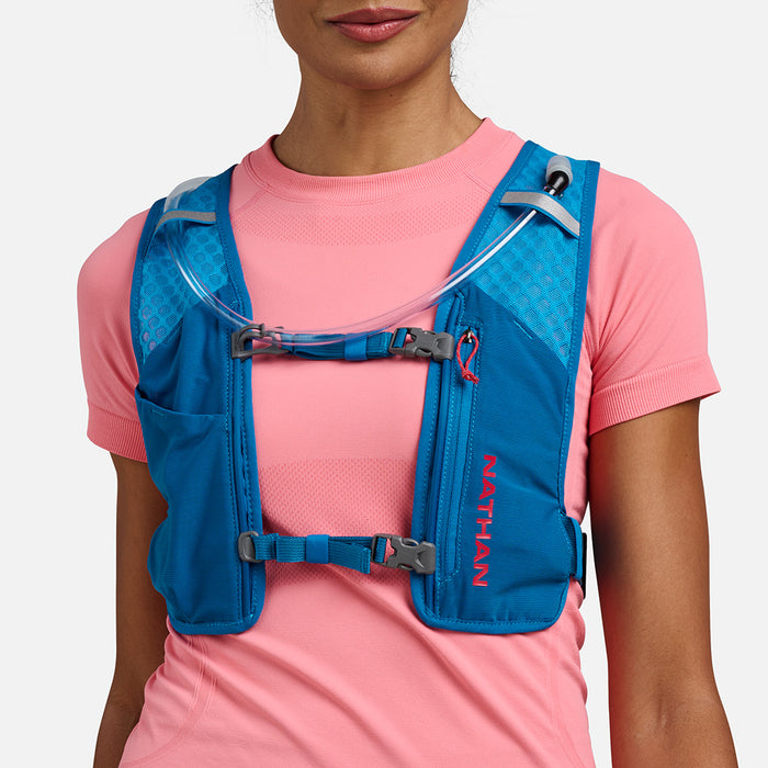 color:Electric Blue/Ribbon Red||seo:Nathan QuickStart 3.0 6 Liter Hydration Pack - Electric Blue/Ribbon Red - On Model - Front View