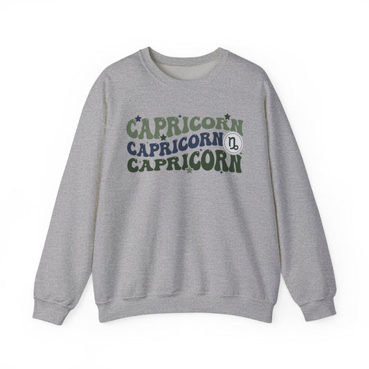 light pink sweatshirt with retro Capricorn zodiac symbol and vintage celestial design