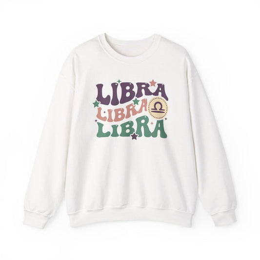 light pink sweatshirt with retro libra zodiac sign design and vintage typography