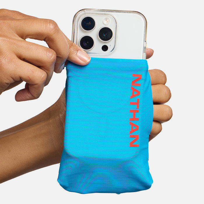 color:Electric Blue/Ribbon Red||seo:Nathan SpeedDraw 2 12oz Handheld Flask - Electric Blue/Ribbon Red - Model Pulling iPhone from Pouch